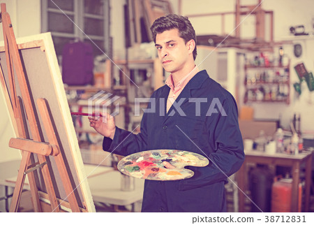 Male artist drawing in studio Male artist drawing in studio 38712831