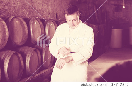 Male keeping ageing process of wine Male keeping ageing process of wine 38712832
