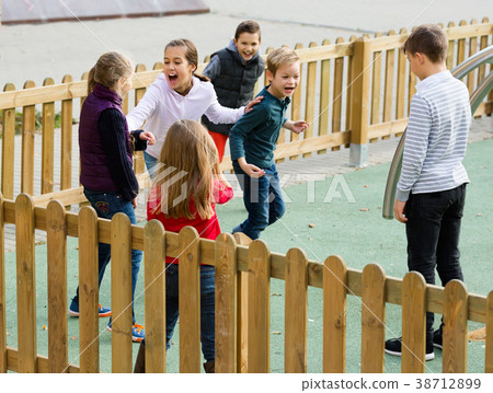 Little boys and girls playing Touch-last Little boys and girls playing Touch-last 38712899