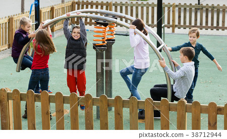 Children playing on swing 38712944