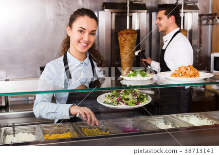 Staff posing at kebab counter Staff posing at kebab counter 38713141
