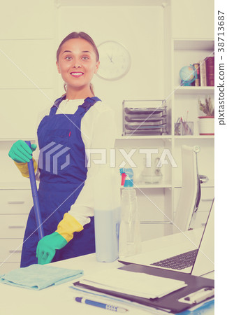 Woman cleaning at company office 38713687
