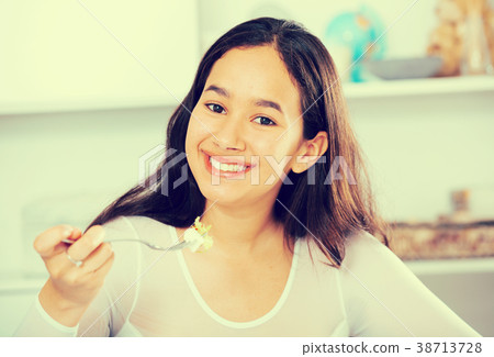 young woman eating freshness salad young woman eating freshness salad 38713728
