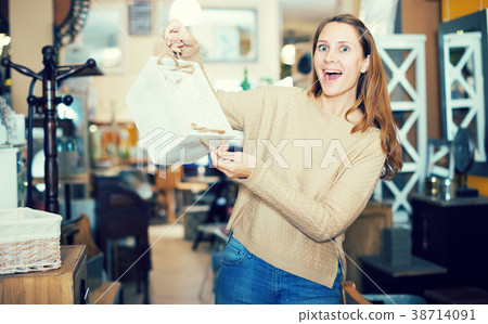 Satisfied woman with stylish basket 38714091
