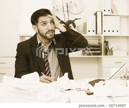 Man employee is indignant because he is having issues with project Man employee is indignant because he is having issues with project 38714097