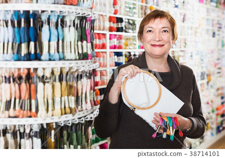 Female standing with accessories for embroidery Female standing with accessories for embroidery 38714101