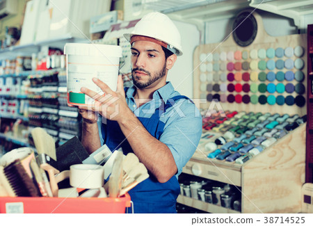 foreman closely reading instruction on paint 38714525