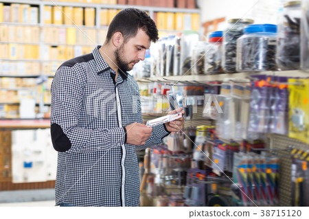 Adult man choosing new DIY details 38715120