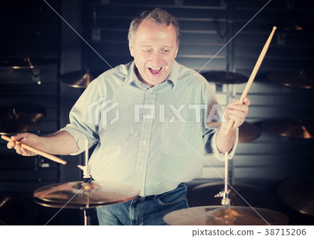 Musician playing on drum kit Musician playing on drum kit 38715206