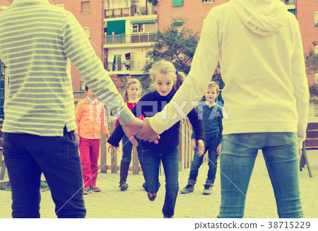 Friendly kids playing in forcing the city gates Friendly kids playing in forcing the city gates 38715229