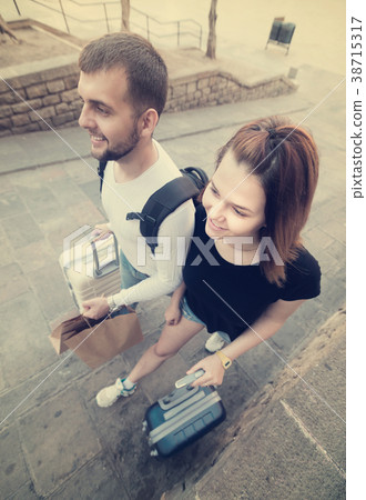 Positive couple man and woman going to center Positive couple man and woman going to center 38715317