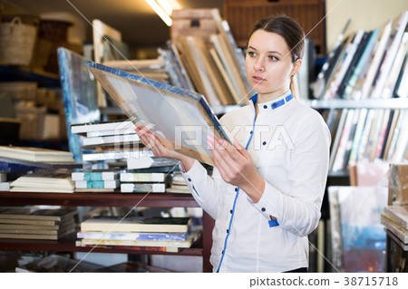 female is looking on pictures 38715718