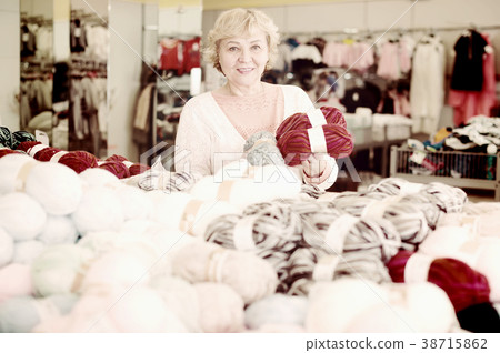 woman holding thread for knitting woman holding thread for knitting 38715862