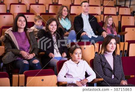 People watching movie in cinema People watching movie in cinema 38715863