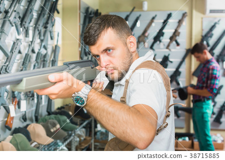 Men choosing air weapon Men choosing air weapon 38715885