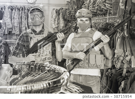 men in army uniform with gun in military market men in army uniform with gun in military market 38715954