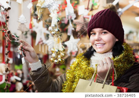 Teenage girl in coat posing at Christmas market Teenage girl in coat posing at Christmas market 38716405