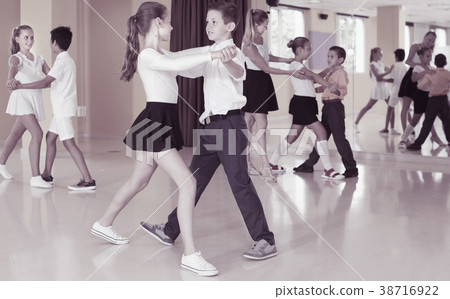 Positive kids are dancing waltz 38716922