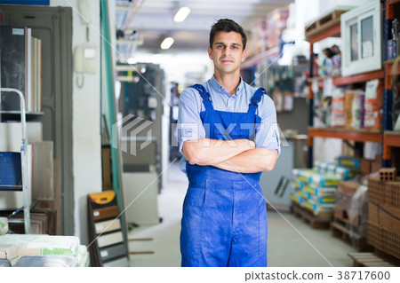 Portrait of guy in uniform on his workplace Portrait of guy in uniform on his workplace 38717600