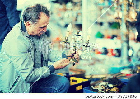 Male visiting flea market 38717830