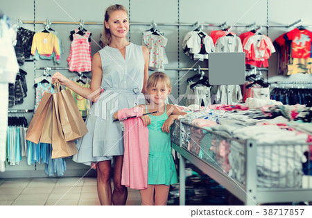 Pretty mother with daughter holding packages 38717857