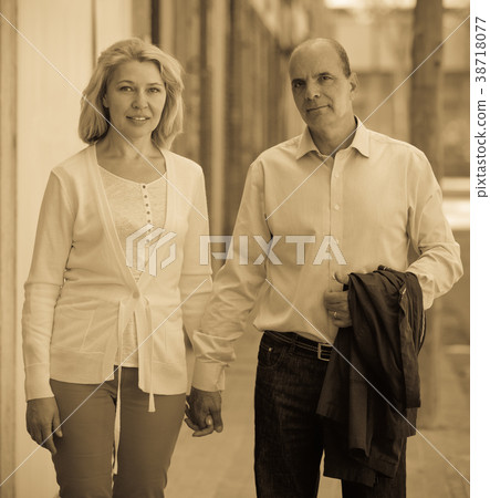 Walking through street mature family couple 38718077
