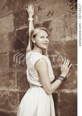 female standing near the stone wall female standing near the stone wall 38718227