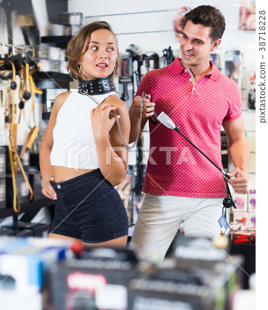 Portrait of glad girl and man holding collar Portrait of glad girl and man holding collar 38718228