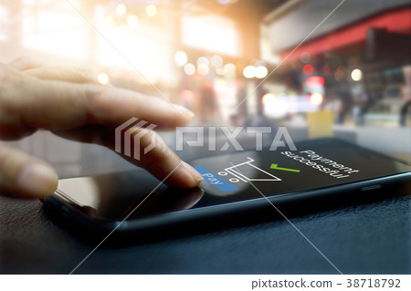 Hand touching mobile screen Payment successful Hand touching mobile screen Payment successful 38718792