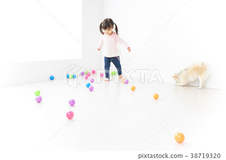 Child playing with a dog Child playing with a dog 38719320