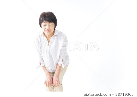 Elderly woman feeling knee pain Elderly woman feeling knee pain 38719363