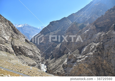 Rugged mountains, trails and blue sky in the Himalayas mountain region of India 38720560