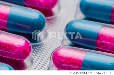 Full frame of blue-pink anti fungal capsule pills 38721807