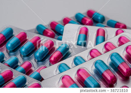 Pile of blue, pink anti fungal capsule pills  38721810