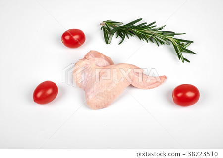 Raw chicken wings, tomatoes and rosemary isolated 38723510