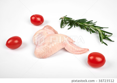 Raw chicken wings, tomatoes and rosemary isolated 38723512