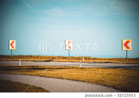 Turn left sign on a country road 38725053