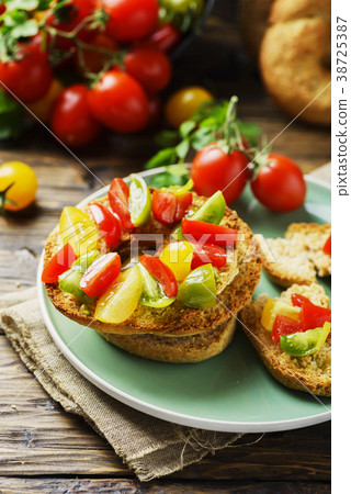 Traditional italian bread frisella with tomatos 38725387