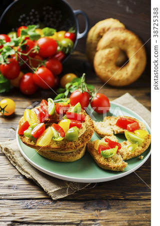 Traditional italian bread frisella with tomatos 38725388