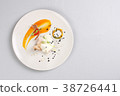 chicken breast with vegetables on a white plate. 38726441