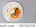 chicken breast with vegetables on a white plate. 38726458