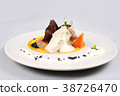 chicken breast with vegetables on a white plate. 38726470