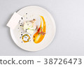 chicken breast with vegetables on a white plate. 38726473