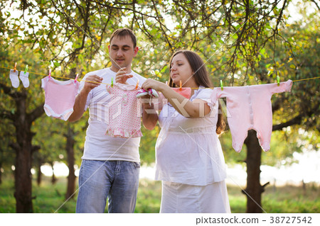 Pregnant couple outdoor Pregnant couple outdoor 38727542
