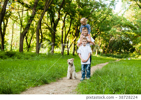 Kids with fox terrier dog Kids with fox terrier dog 38728224