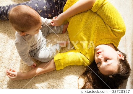Teenager girl takes care of her brother Teenager girl takes care of her brother 38728537