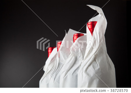 Four bottles on black 38728570