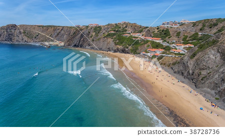 Aerial. Tourists surfers on the beach of Arrifana. 38728736