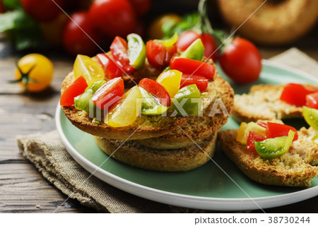 Traditional italian bread frisella with tomatos Traditional italian bread frisella with tomatos 38730244