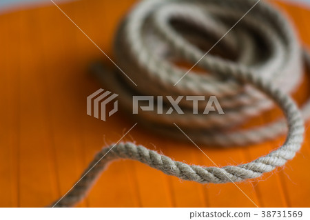 Roll of rough rope against the background  38731569